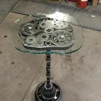 Table made of metal gears with a glass top